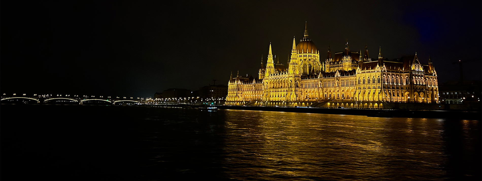 nightime image of a castle and bridge