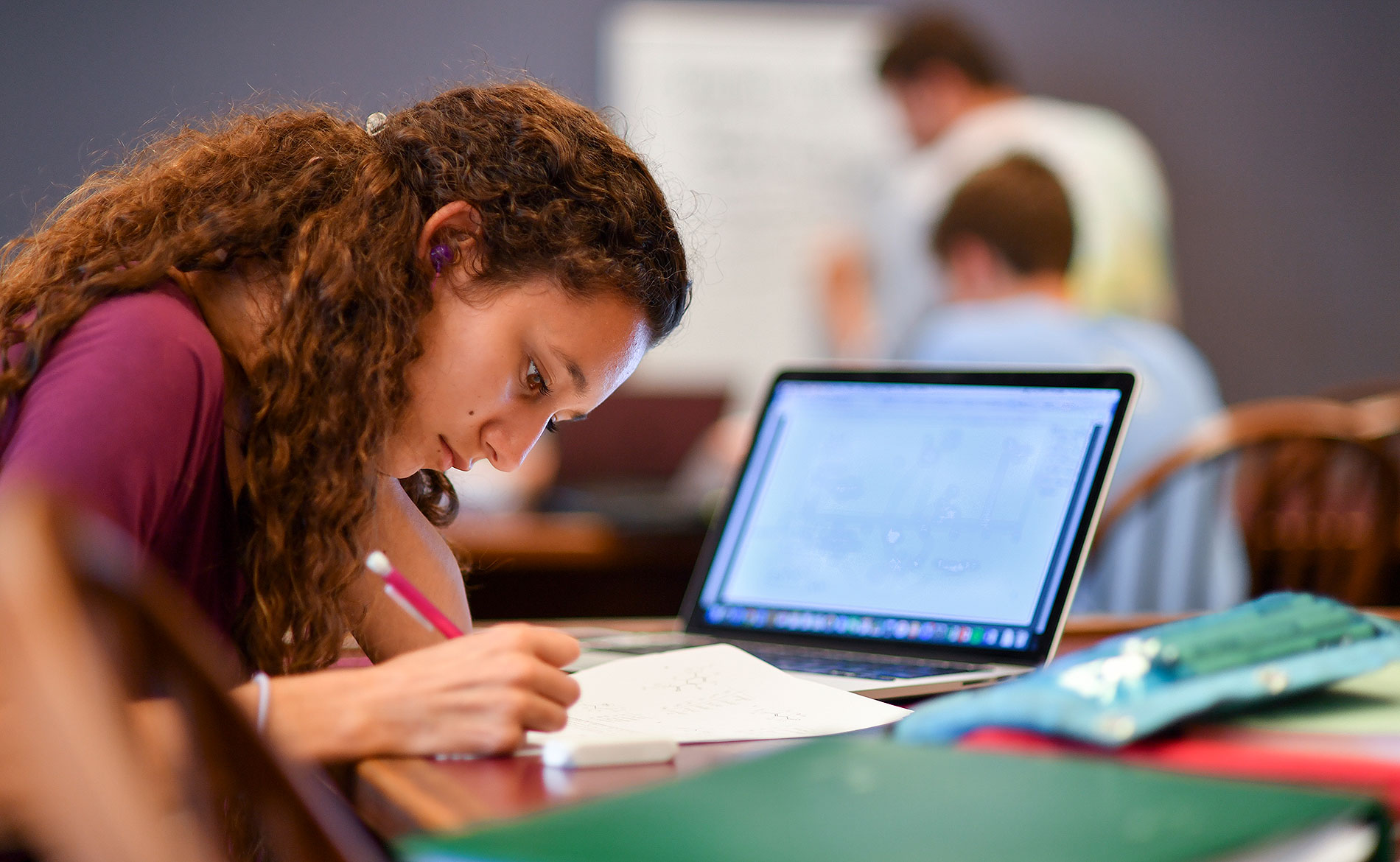 Female student taking notes