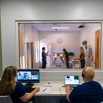 Professors watching students