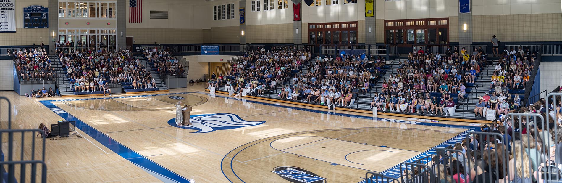 Gathering of students in the Cage Center Basketball stands