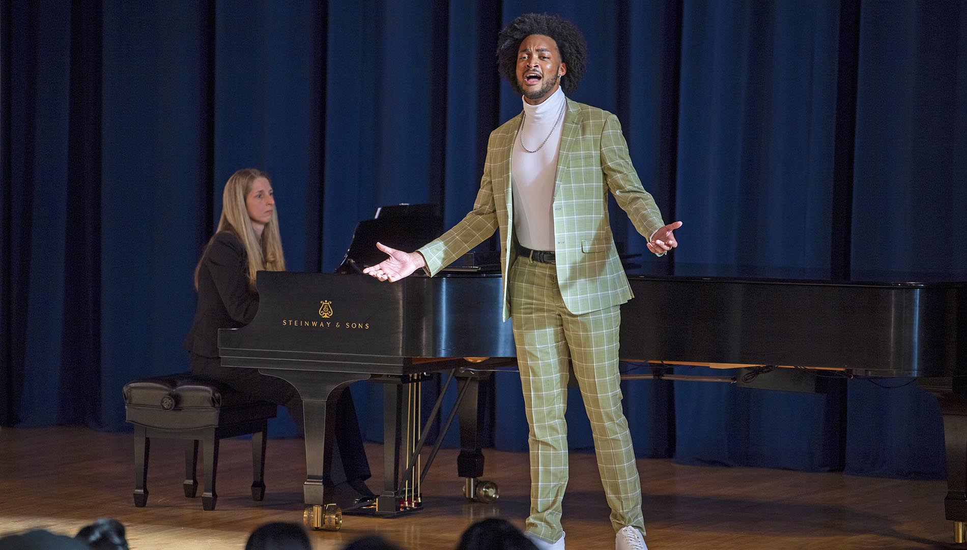Singer with a grand piano