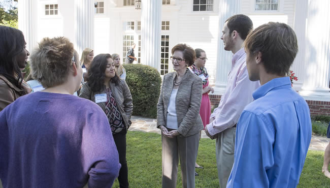 Audrey Bailey and group of people chatting