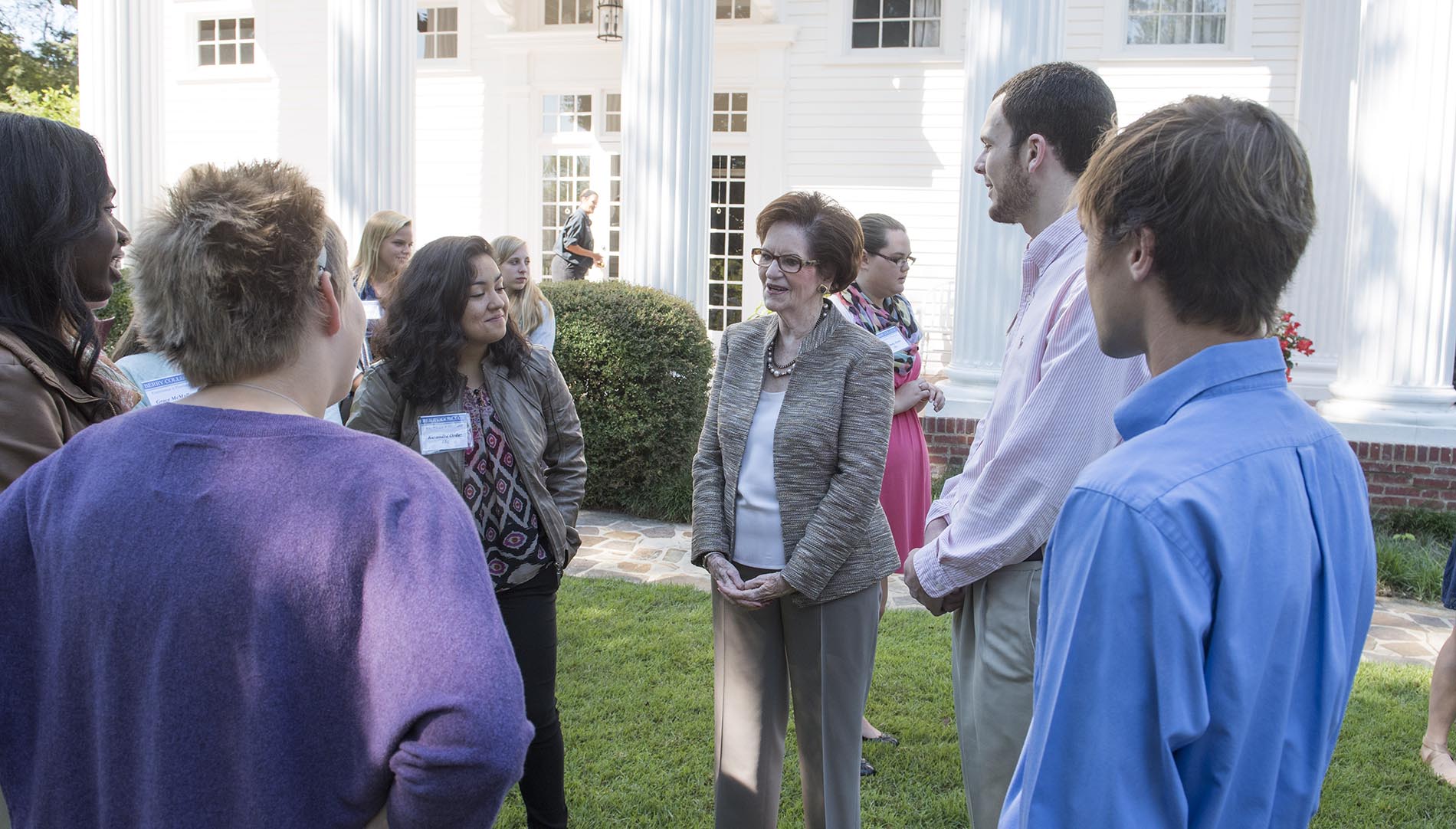 Audrey Bailey and group of people chatting