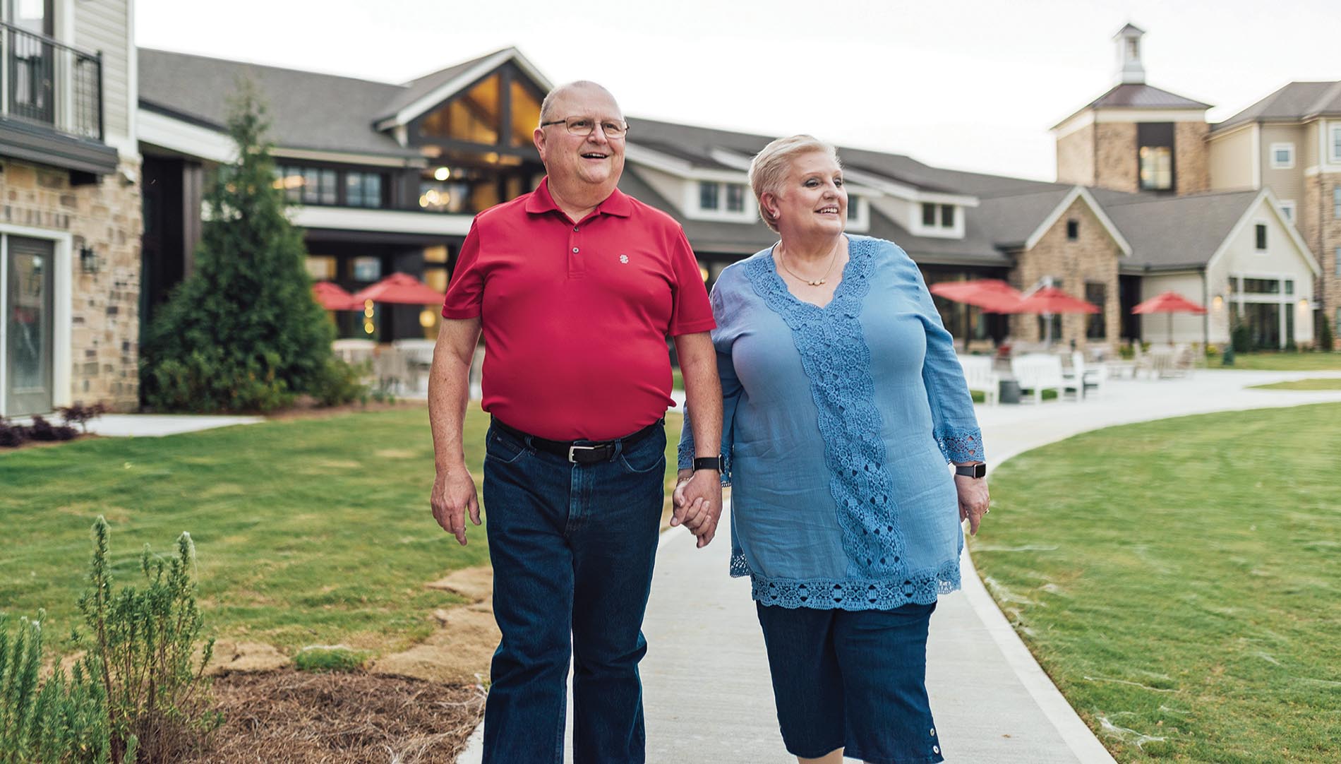 Sam and Nancy Duval Ratcliffe walking together while holding hands