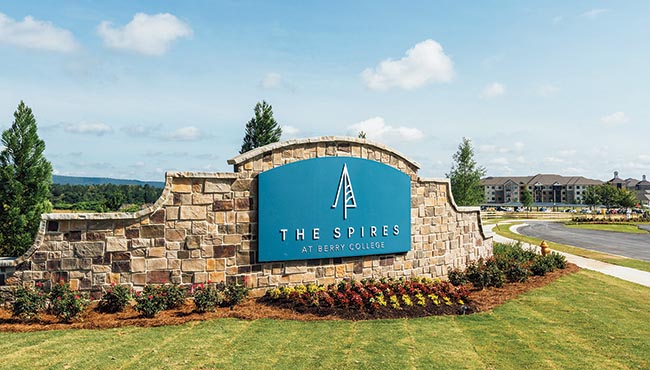 Sam and Nancy Duval Ratcliffe walking together while holding hands