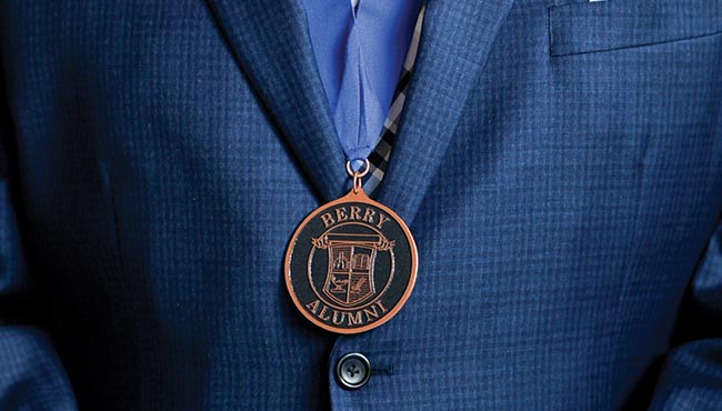 Berry Alumni medal on a grey background