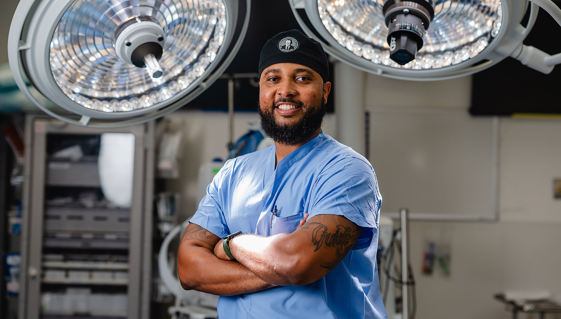 President Mazumder against a background of blue bokeh lights