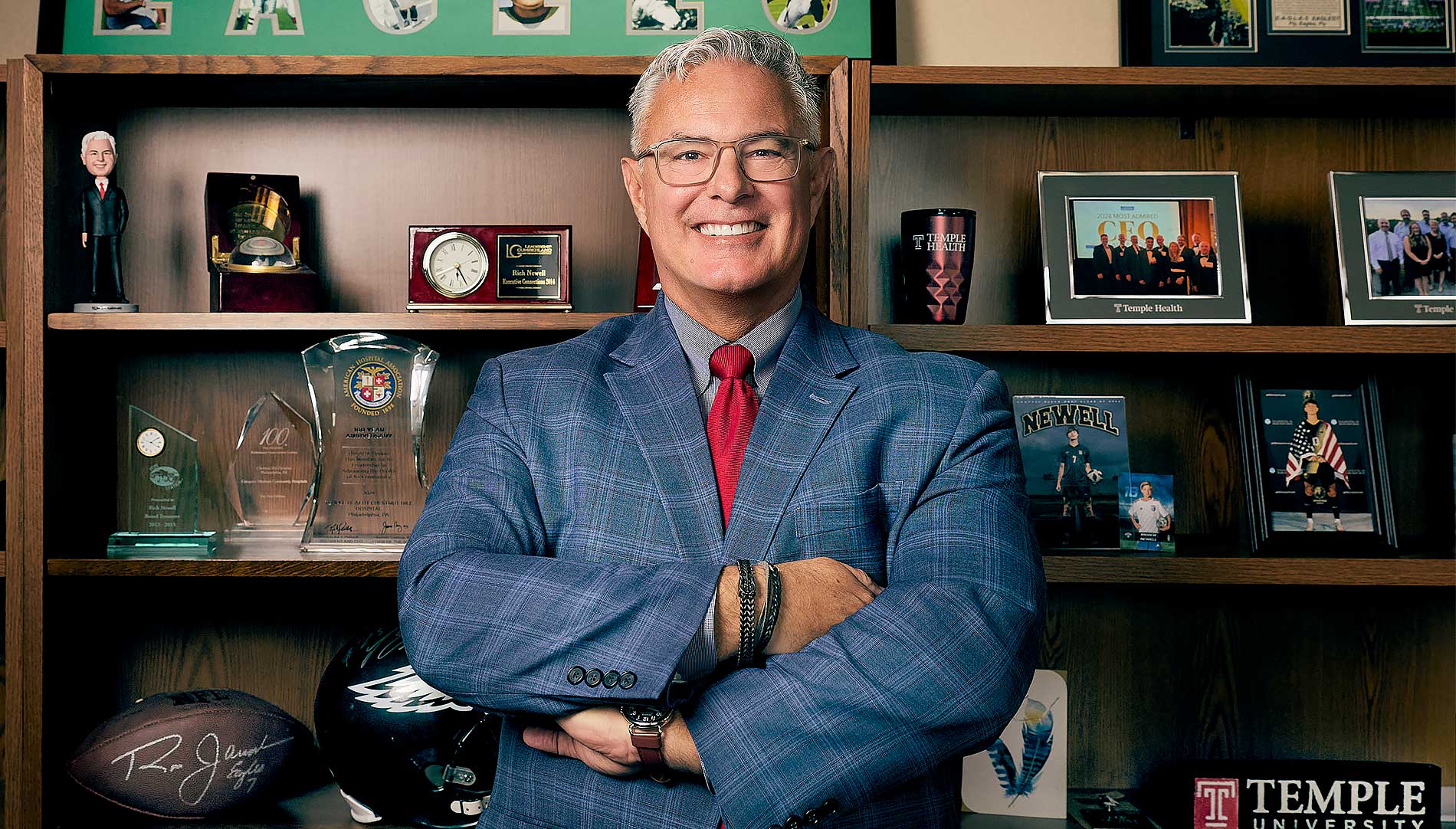 Danielle Cain working with a fellow nurse with a transparent image of her working with a patient in the background.