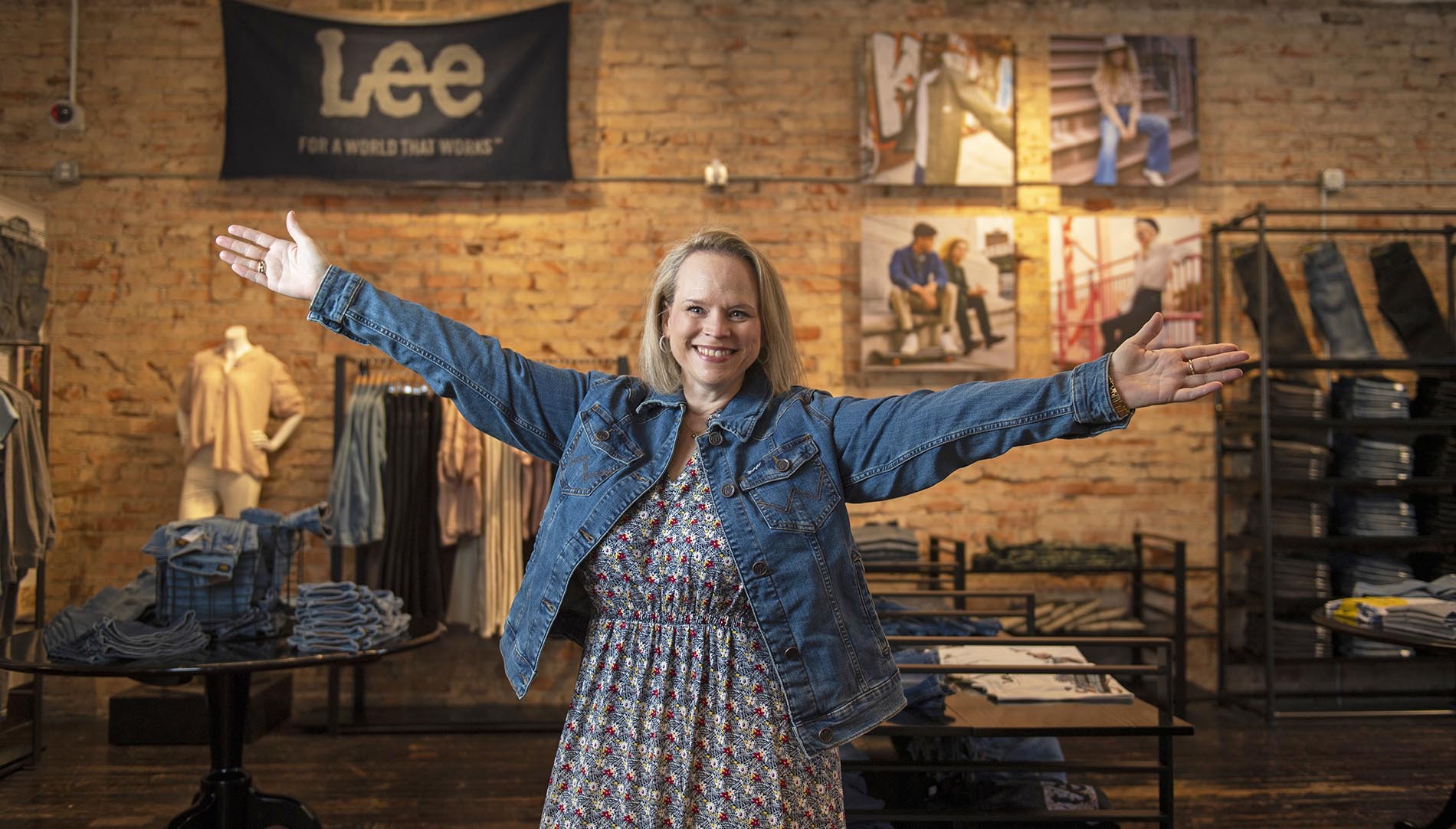 Denise Sumner with her arms spread wide