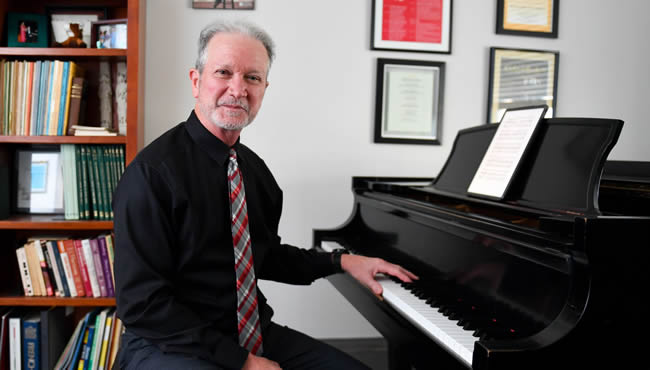 Kris Carlisle at a piano