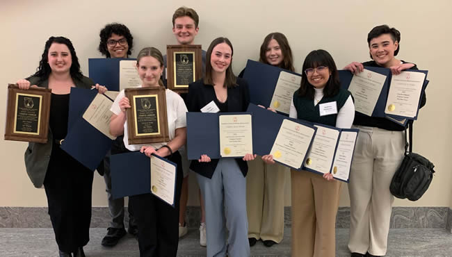 Campus Carrier student employees holding awards