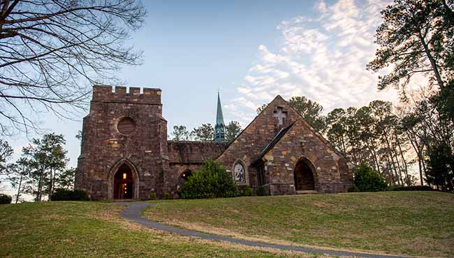 The Berry College Frost Chapel lit from behind at sunset