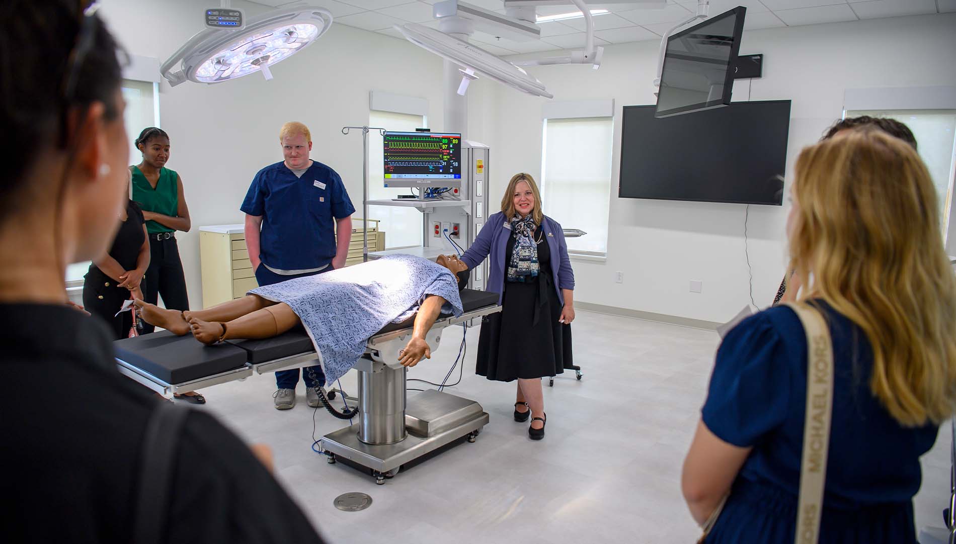 Faculty, students and stakeholders in the Morgan-Bailey Hall Operating Room