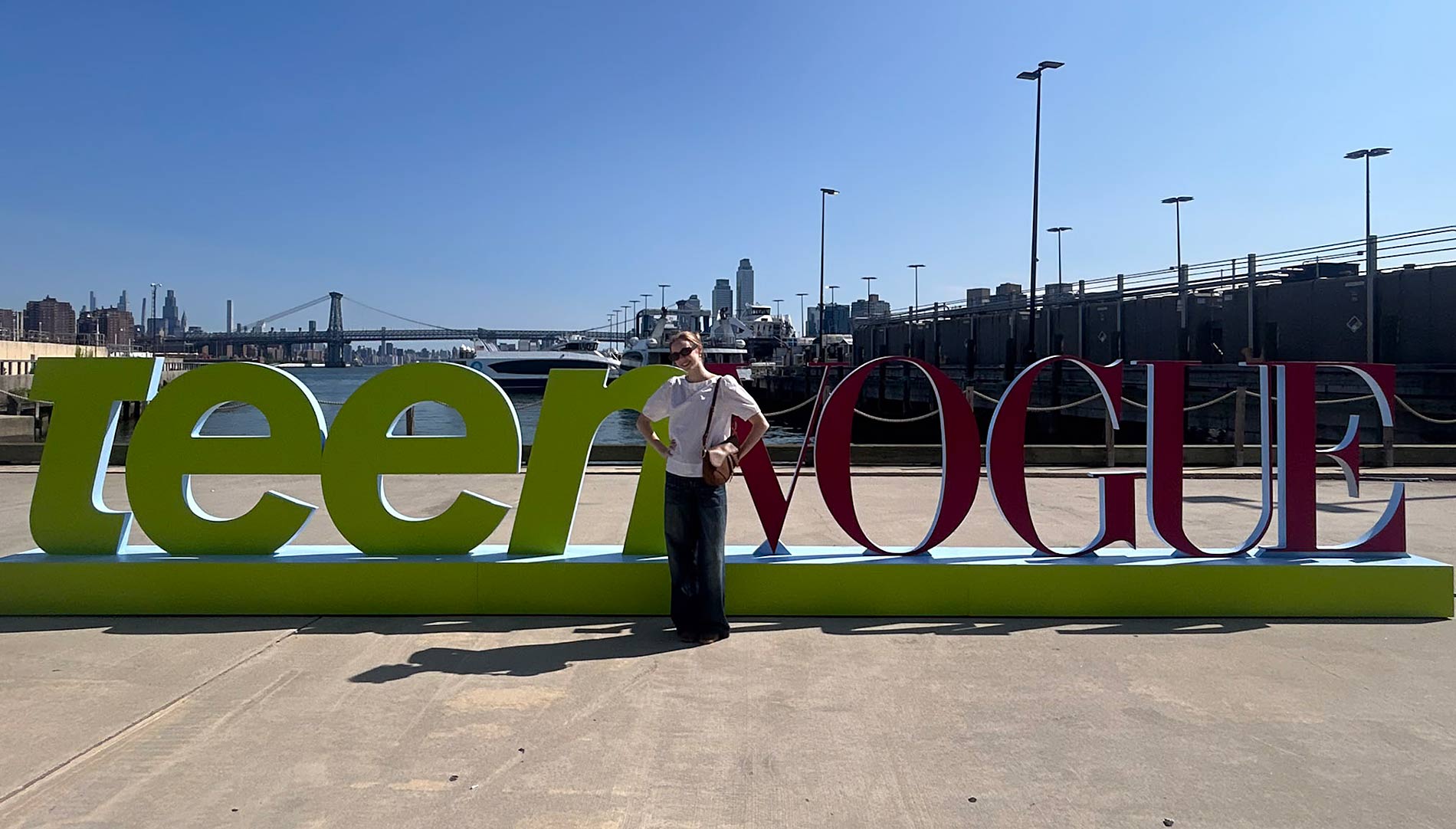 Audrey Bennett in front of the Teen Vogue sign in New York