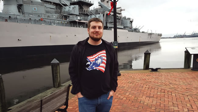 James Padgett in front of large ship
