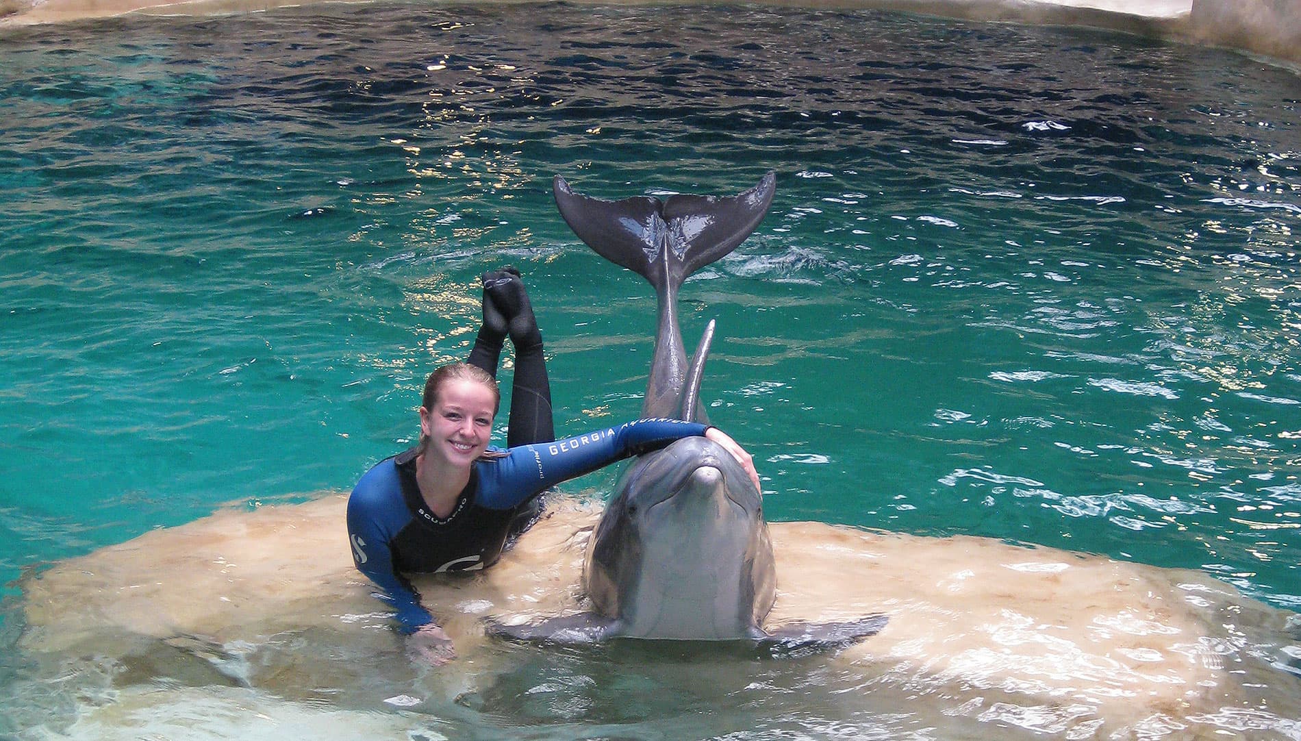             Works with dolphins at the Georgia Aquarium     
