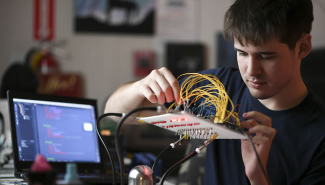 Patrick Groh working on a circuit board