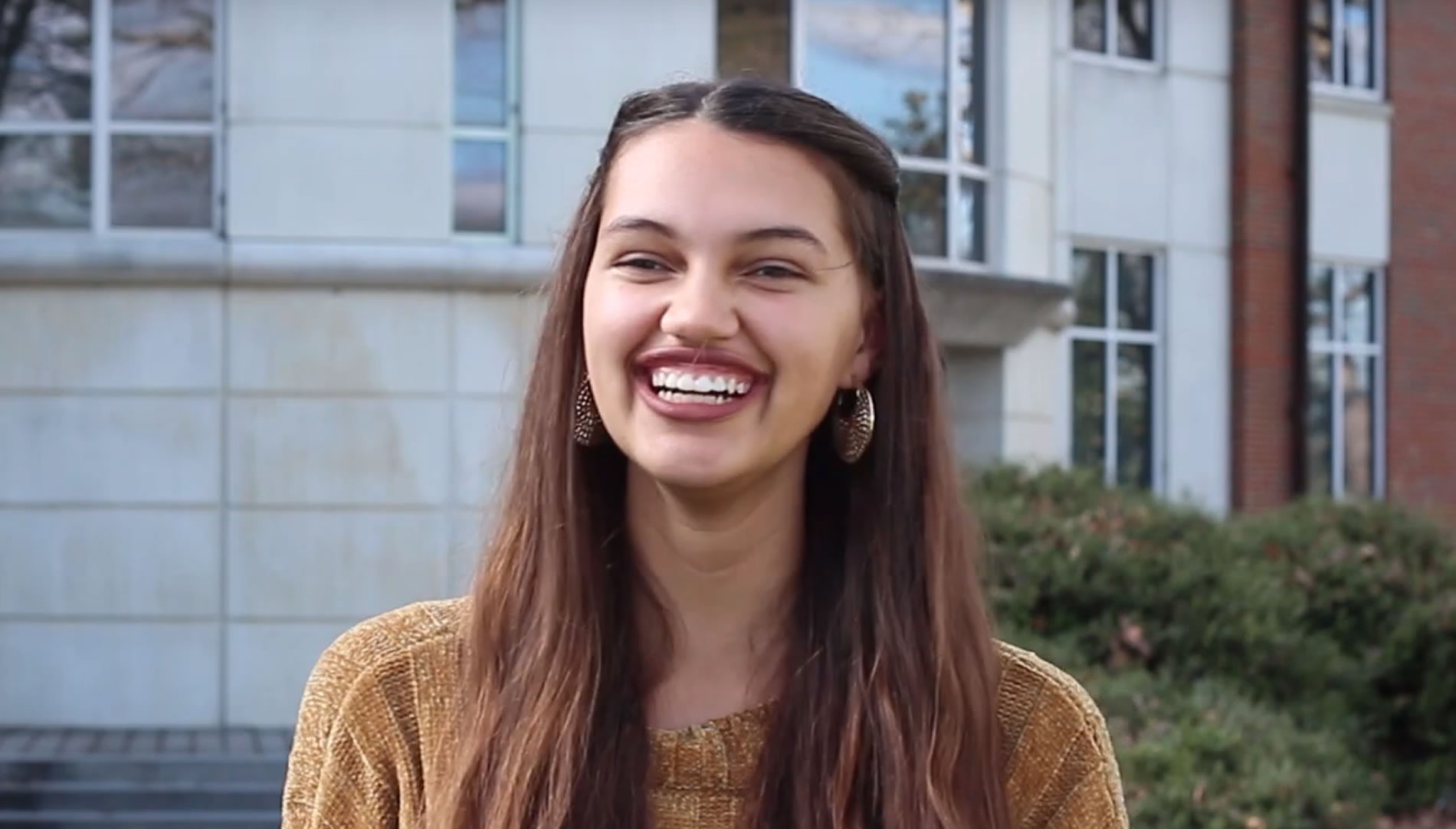Trinity Hutchins in front of McAllister Building