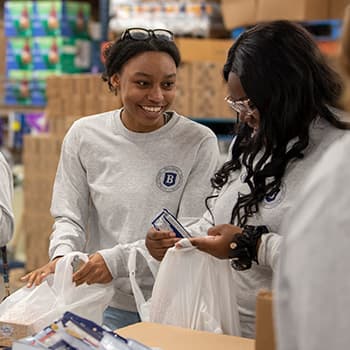 Students working at a food pantry